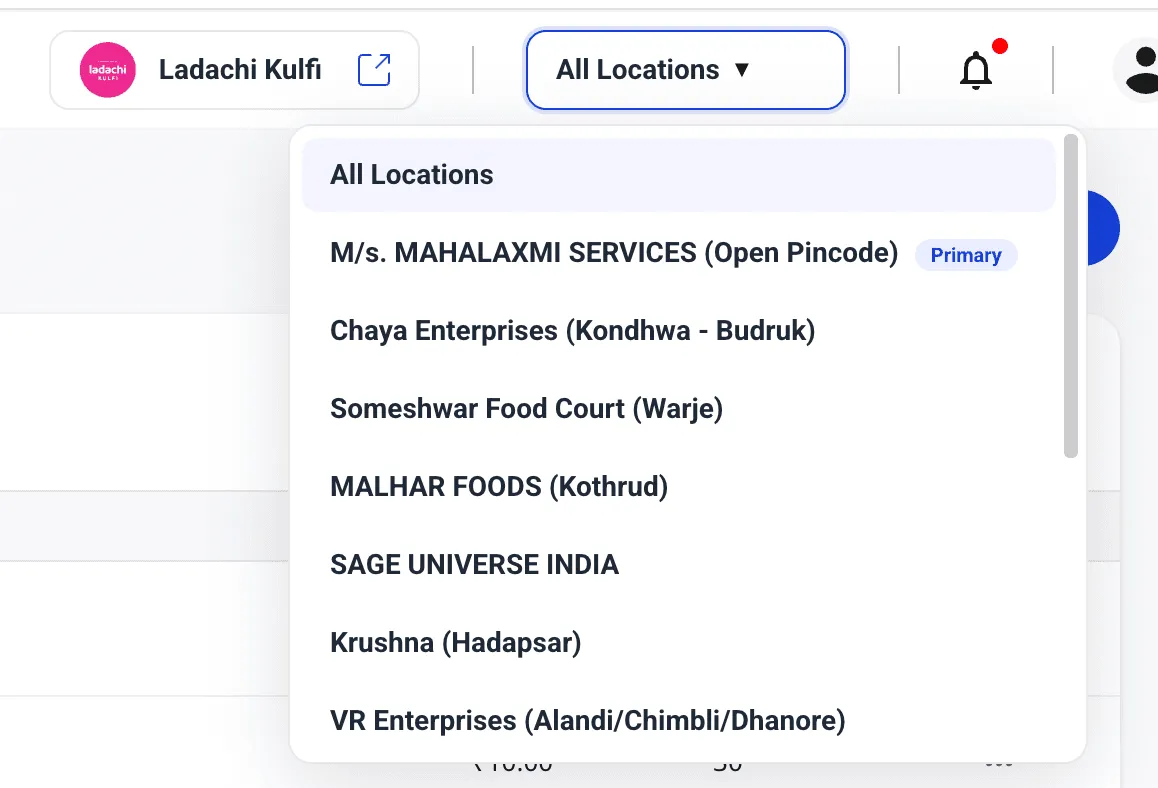 Shoopy top-bar header showing the All Locations switcher button with the dropdown open — All Locations at the top, then the Primary location with a Primary badge, followed by all other store locations
